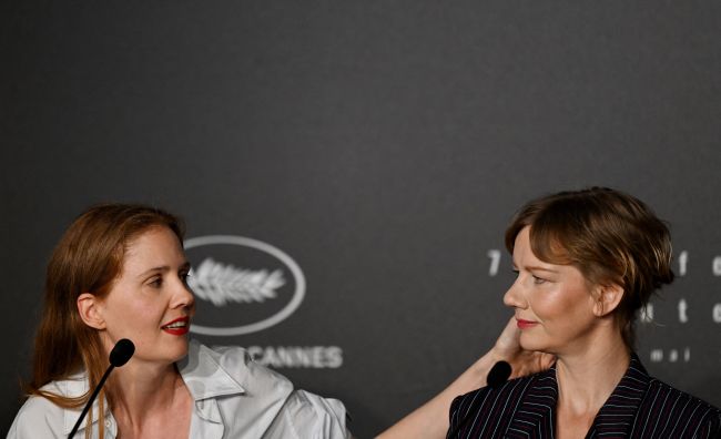 French director Justine Triet (L) and German actress Sandra Hueller attend a press conference for the film Anatomie d'une Chute (Anatomy of a Fall) during the 76th edition of the Cannes Film Festival in Cannes, southern France, on May 22, 2023. (Photo by Julie SEBADELHA / AFP) (Photo by JULIE SEBADELHA/AFP via Getty Images)